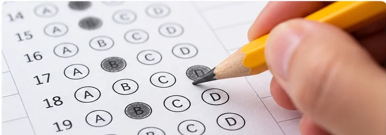Student filling in multiple choice answer bubbles with a sharpened number 2 pencil