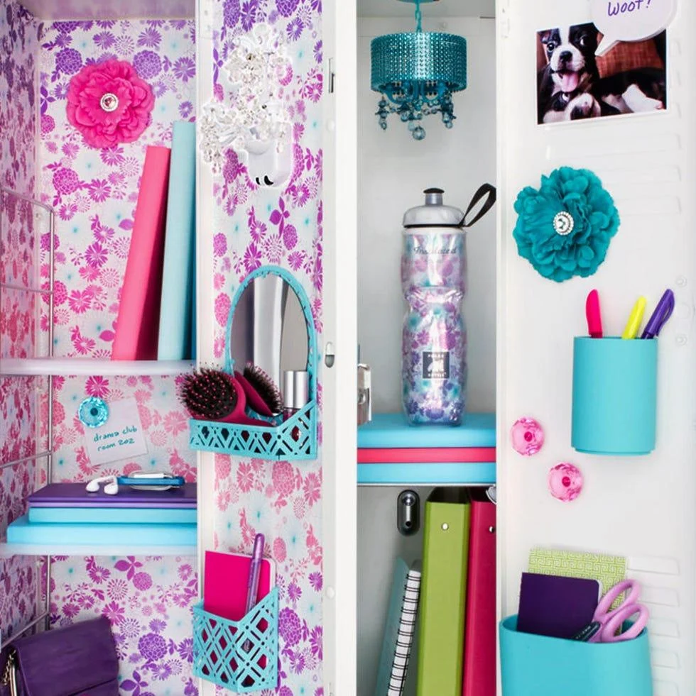 Pink and purple floral locker decoration with turquoise organizers and colorful school supplies